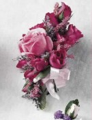 Corsage of deep pink roses and magenta alstroemeria.