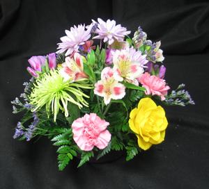 Summer is here! Why not celebrate with a lovely, lively table arrangement? Alstromeria, roses, spider mums and godetia arranged in a plastic container with oasis. Long lasting! Eco friendly.