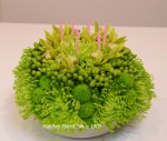 Green flower birthday cake we made for an Irish birthday party. We can use anynatural flower colour. Pink, yellow, mauve or a mixture. Notice the little candles.