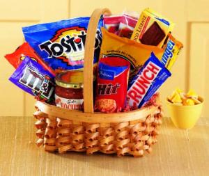 No matter the occasion, they'll appreciate our Big Munch basket. An oval braided basket holds sweet and salty munchies - Tostitos and salsa, pretzel sticks, chocolate cookies, candy bars and popcorn.  products may vary.