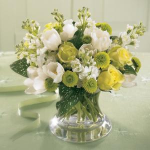 A Lovely expression of comfort, this soothing bouquet of white Tulips and Stock with Jade roses and green button pompons is ideal to send to the family's home. Arranged in a pretty  glass vase, it can easily be displayed in any room.