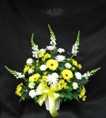 A mix of white and yellow flowers to brighten, a sad time. Gladioli or Snapdragons, sunny yellow Gerbera, Daisies, and Mums