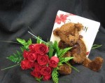 Roses, a plush bear, and chocolates! Happy Anniversary. Chocolates may vary depending upon the freshest shipment. Roses are usually available in red, white, pink, yellow, cream, and orange. Our flower shop has been delivering flowers in Toronto since 1909.