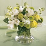 A Lovely expression of comfort, this soothing bouquet of white Tulips and Stock with Jade roses and green button pompons is ideal to send to the family's home. Arranged in a pretty  glass vase, it can easily be displayed in any room.