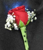 Single red Rose boutonniere and Baby Breath. And a funky white LED light. Shine on! The light lasts 24 hours, a great effect!