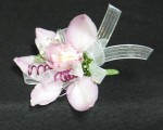 A pin on type, with pink mauve wire. We also make wristlets. A double Cymbidium corsage.