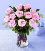 They'll be charmed by this gift of a 18 roses in a glass vase, surrounded by assorted greenery. Available in pink, red, yellow, white or peach.
