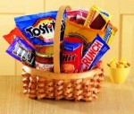 No matter the occasion, they'll appreciate our Big Munch basket. An oval braided basket holds sweet and salty munchies - Tostitos and salsa, pretzel sticks, chocolate cookies, candy bars and popcorn.  products may vary.