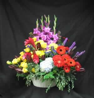 A grand statement of you sympathy, this is truly a large, and impressive arrangement.