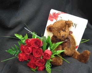 Roses, a plush bear, and chocolates! Happy Anniversary. Chocolates may vary depending upon the freshest shipment. Roses are usually available in red, white, pink, yellow, cream, and orange. Our flower shop has been delivering flowers in Toronto since 1909.